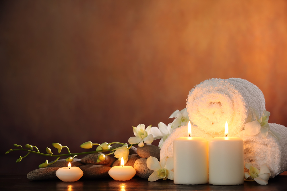 Rolled up towel with tea candles The Arundel Hotel Spa Special