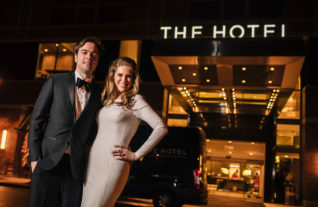 two guests standing outside the Hotel Arundel