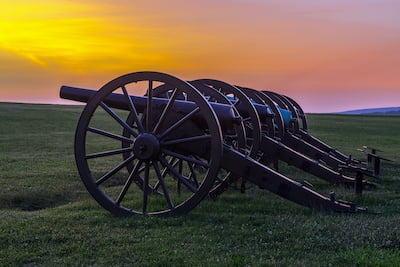 Four pieces of artillery in a row at Antietam National Battlefield in Sharpsburg, Maryland. The battle at Antietam was the bloodiest single-day battle in American history.
