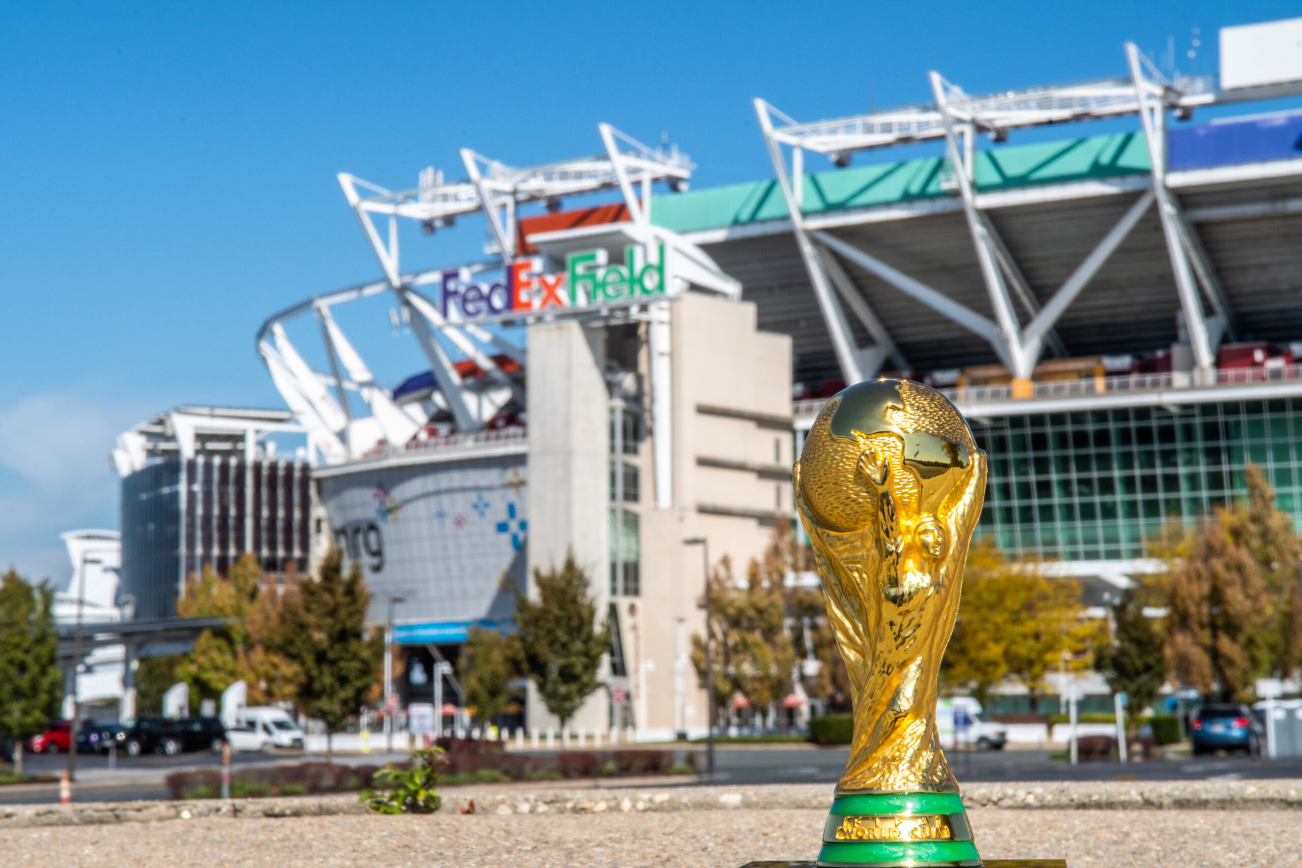 World Cup FIFA gold and green trophy on background FedEx Field Stadium in Washington state of Maryland
