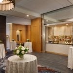 a open bar with tables surrounding it at Hotel Arundel