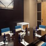 Small meeting room with table and chairs