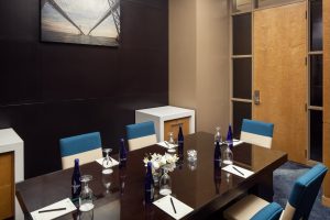 Small meeting room with table and chairs