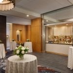 a open bar with tables surrounding it at Hotel Arundel